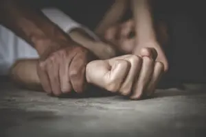 Woman on the ground being sexually assaulted. If you or someone you know has been the victim of sexual assault you need to contact our Austin Sexual Assault Lawyer.