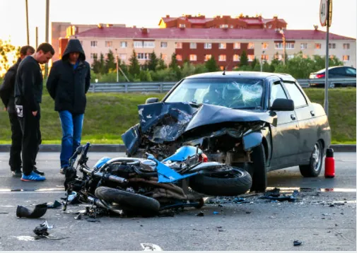 A motorcycle hit by a car.