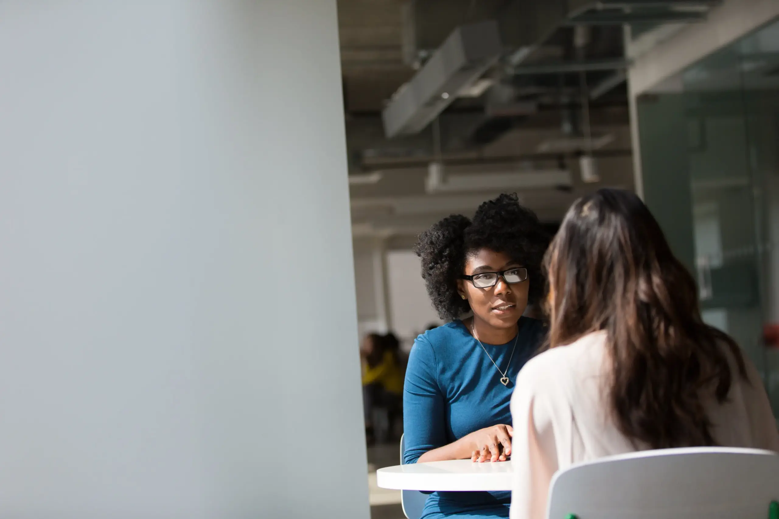 A woman meeting with an attorney.