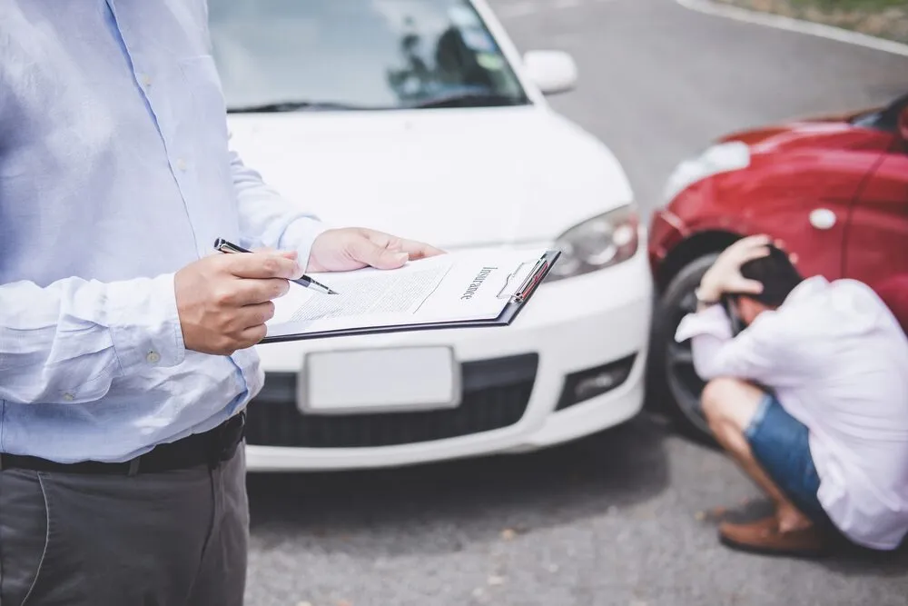 Insurance adjuster and a car accident.