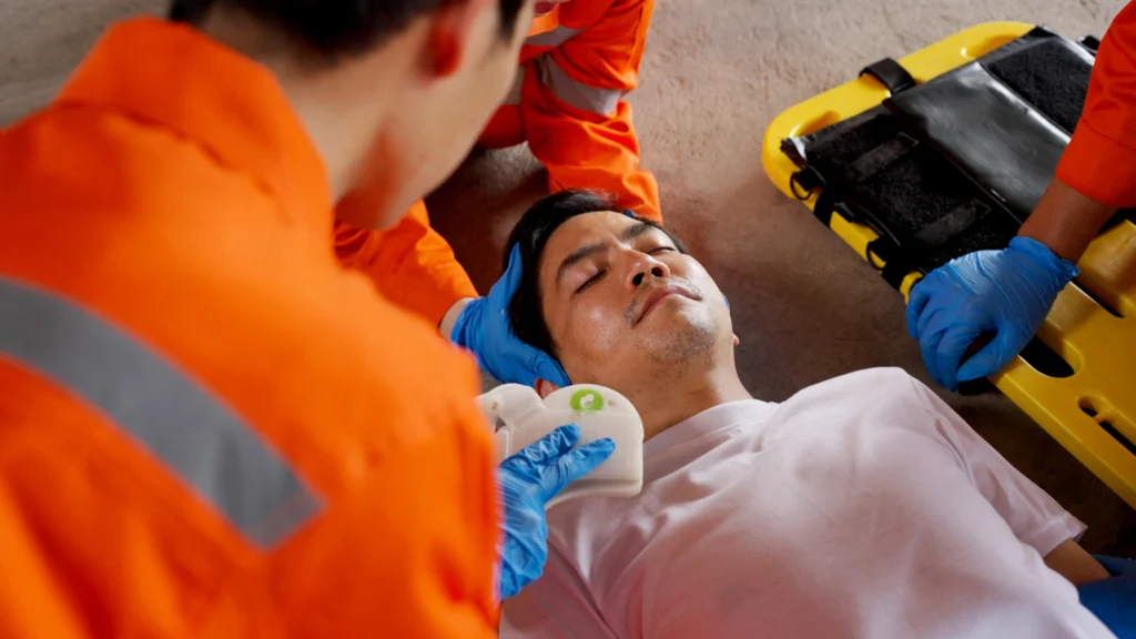 A worker on a stretcher after an injury.