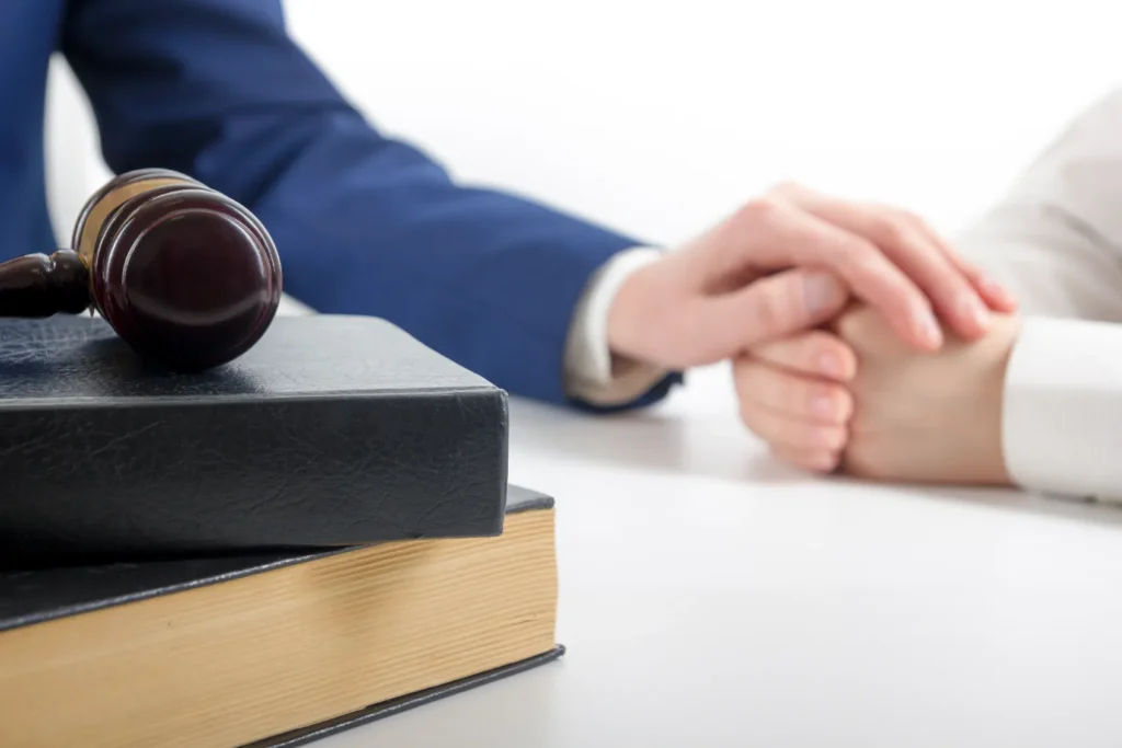 An attorney consoling a client.