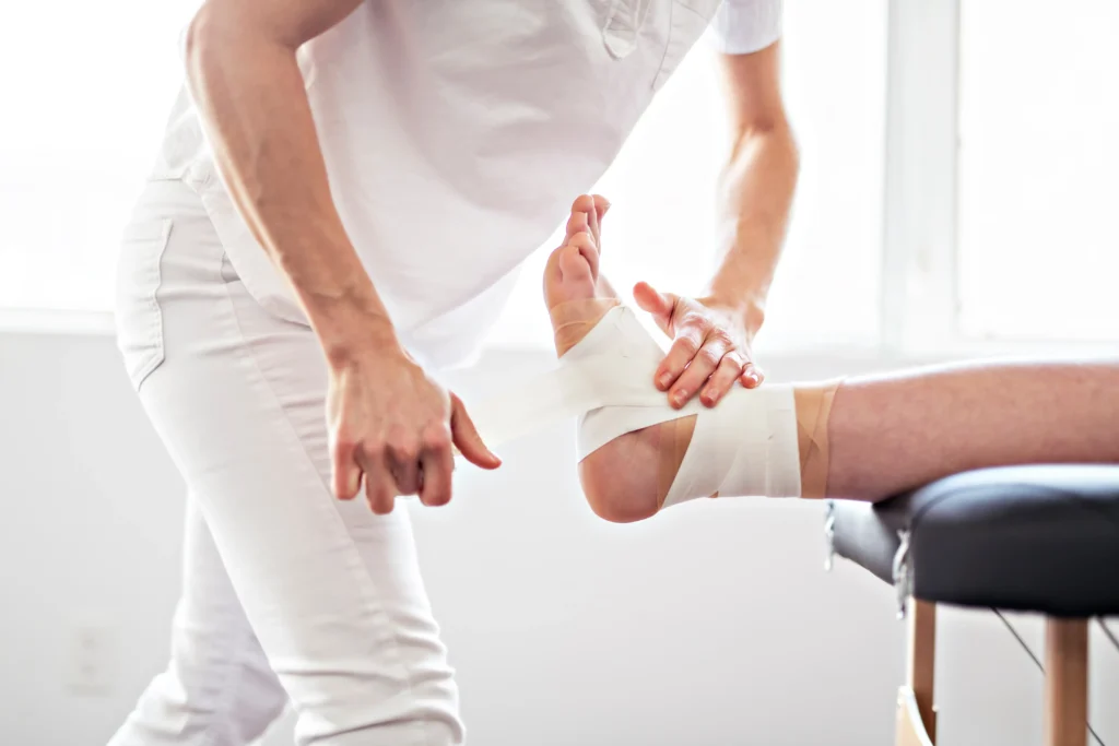 Someone getting their foot wrapped after an injury.