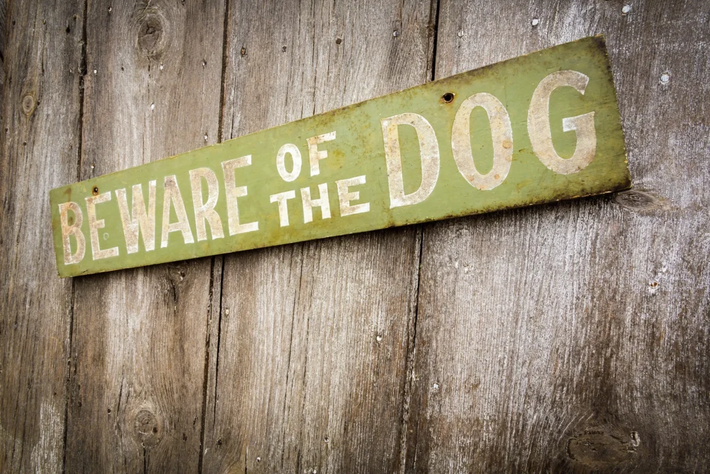 A beware of dog sign to prevent a dog bite in Texas.