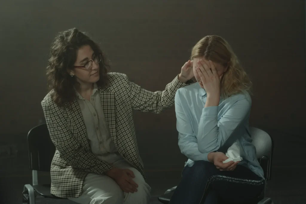 Someone comforting a distressed women.